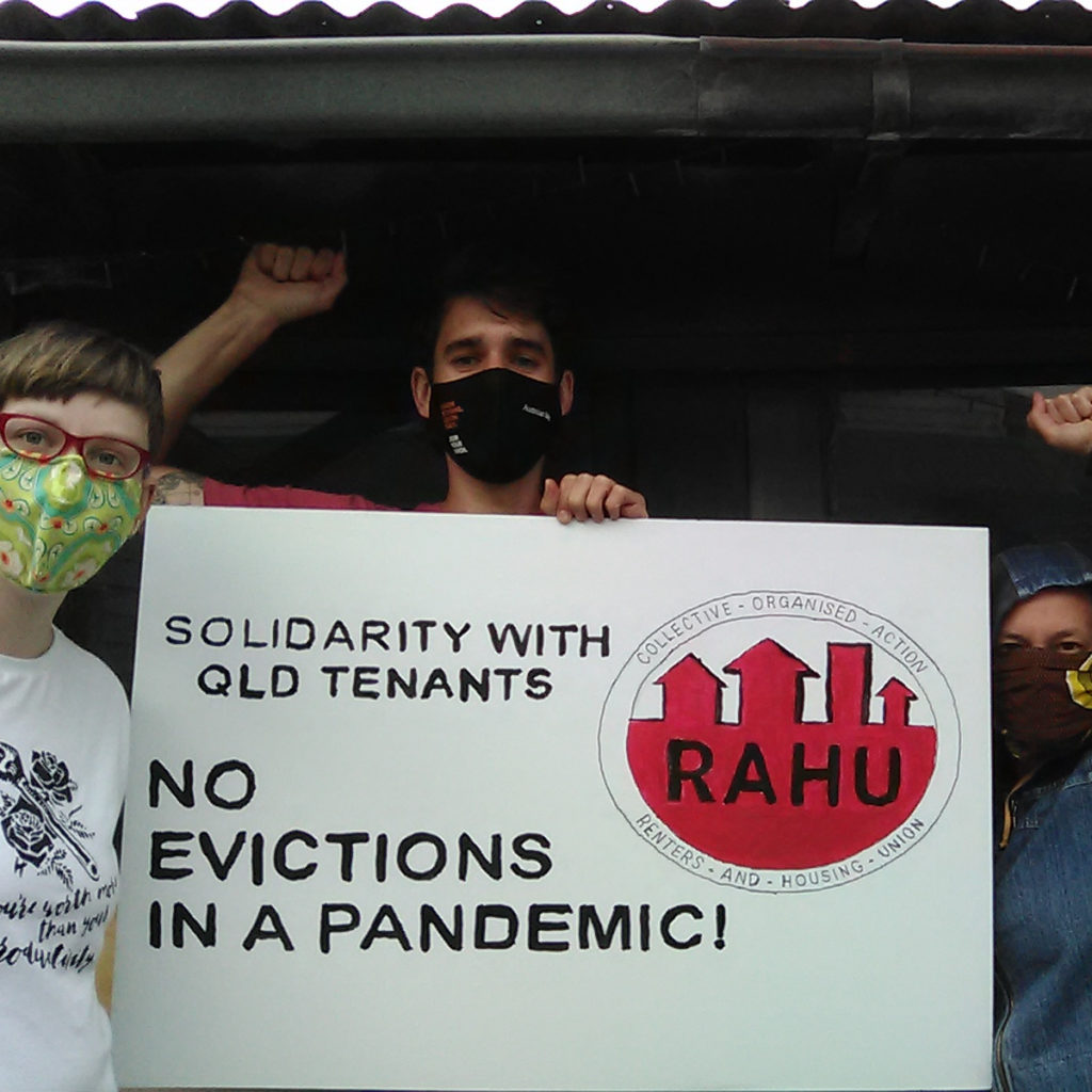 RAHU members holding a sign demanding "Solidarity with Qld tenants. No evictions in a pandemic!"