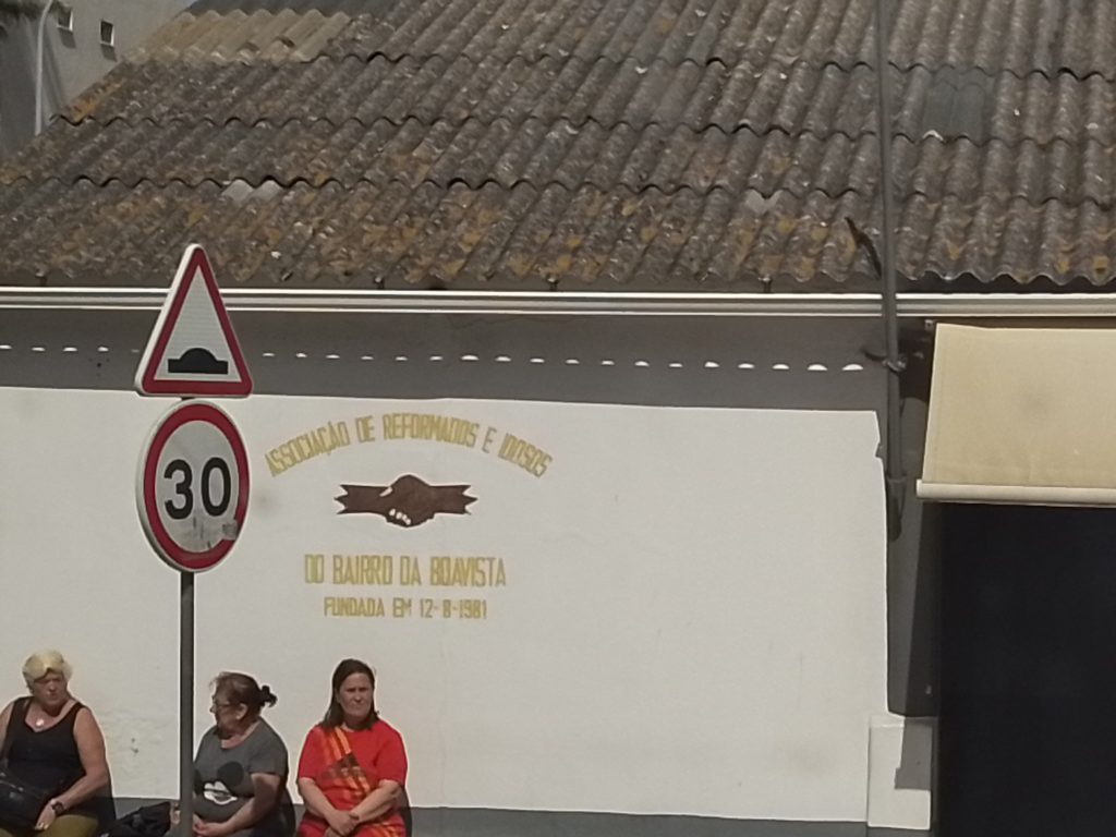 Pictured: Boavista residents outside the Public Tenants Association of Bairro Da Boavista. Founded in 1981.
This office is located in the centre of 4 public housing blocks, across from the new football ground. A new office has been built in the same location, as part of the community centre.